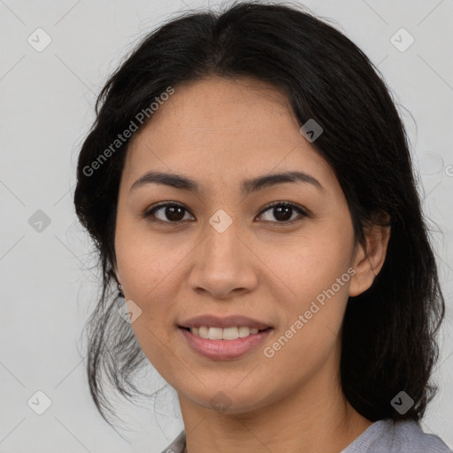 Joyful latino young-adult female with medium  brown hair and brown eyes