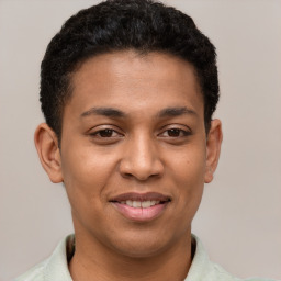 Joyful latino young-adult male with short  brown hair and brown eyes