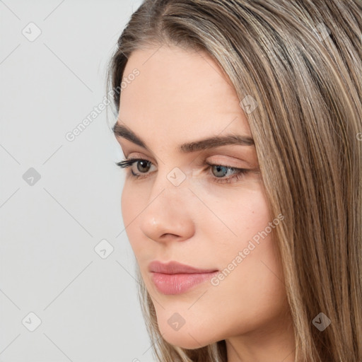 Neutral white young-adult female with long  brown hair and brown eyes