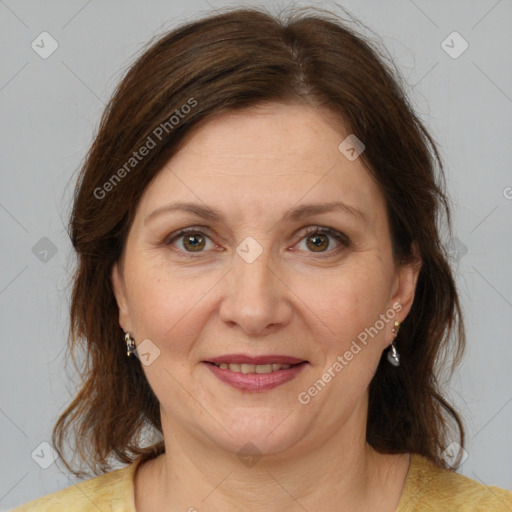 Joyful white adult female with medium  brown hair and brown eyes