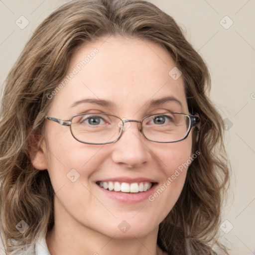 Joyful white adult female with medium  brown hair and green eyes