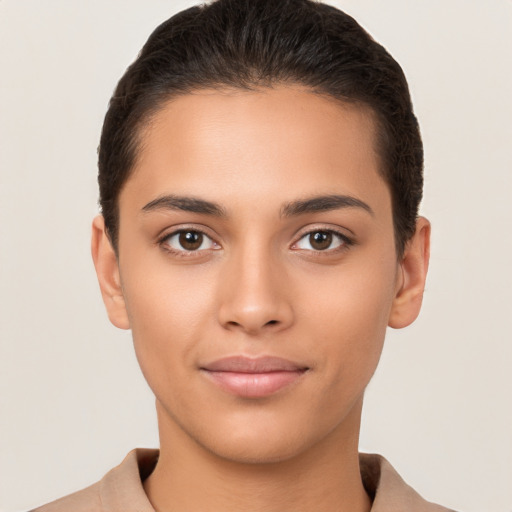 Joyful latino young-adult female with short  brown hair and brown eyes