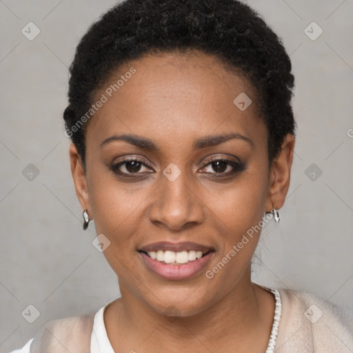 Joyful black young-adult female with short  black hair and brown eyes