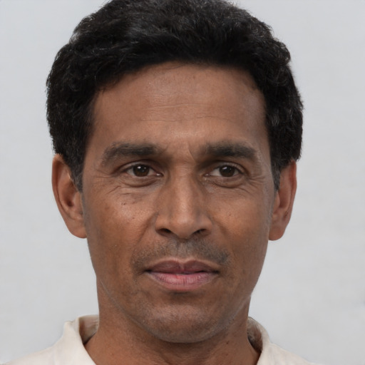 Neutral black adult male with short  black hair and brown eyes