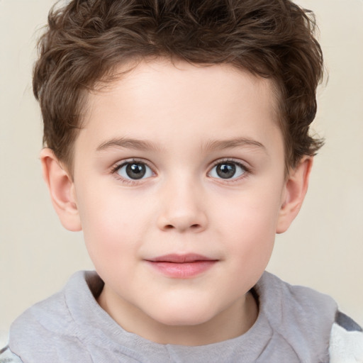 Joyful white child male with short  brown hair and brown eyes