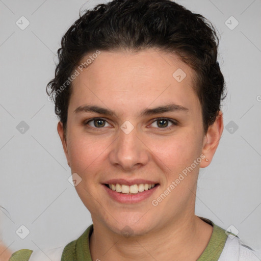 Joyful white young-adult female with short  brown hair and grey eyes