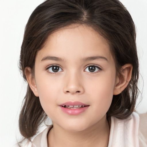 Joyful white child female with medium  brown hair and brown eyes