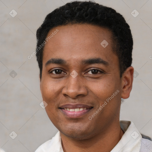 Joyful black young-adult male with short  black hair and brown eyes