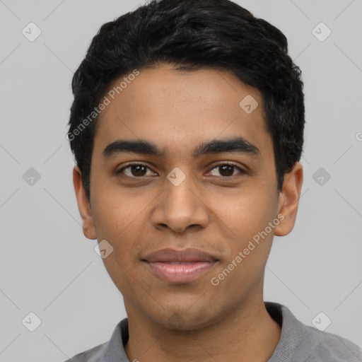 Joyful latino young-adult male with short  black hair and brown eyes