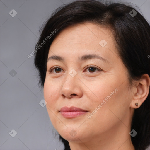 Joyful white adult female with medium  brown hair and brown eyes