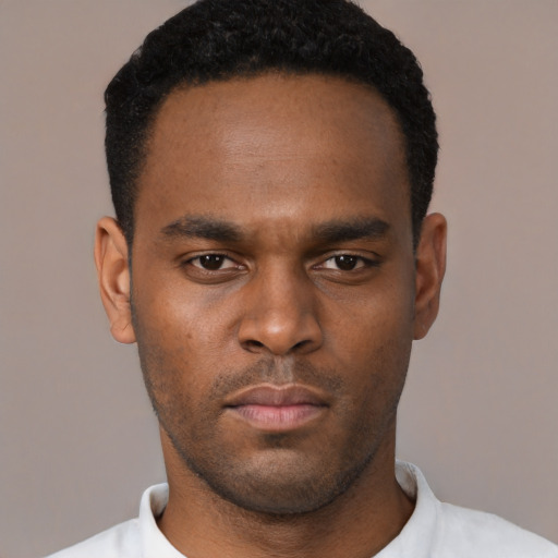 Neutral black young-adult male with short  black hair and brown eyes