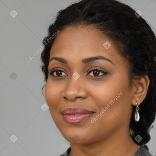 Joyful black young-adult female with long  black hair and brown eyes