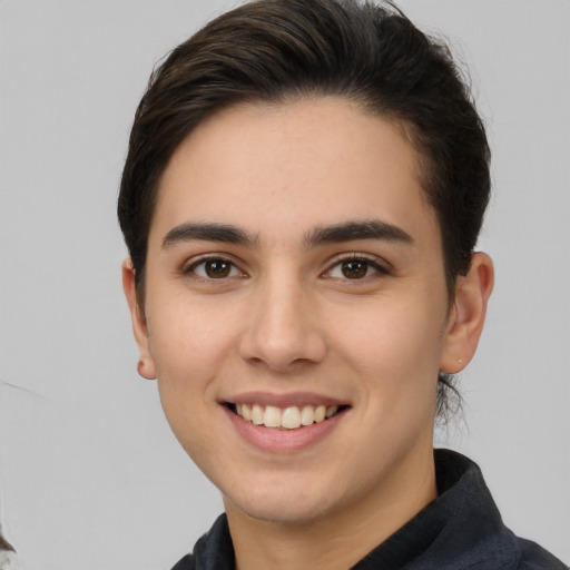 Joyful white young-adult female with short  brown hair and brown eyes