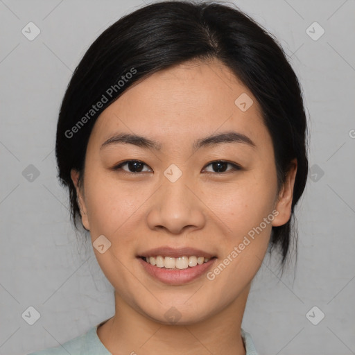 Joyful asian young-adult female with medium  black hair and brown eyes