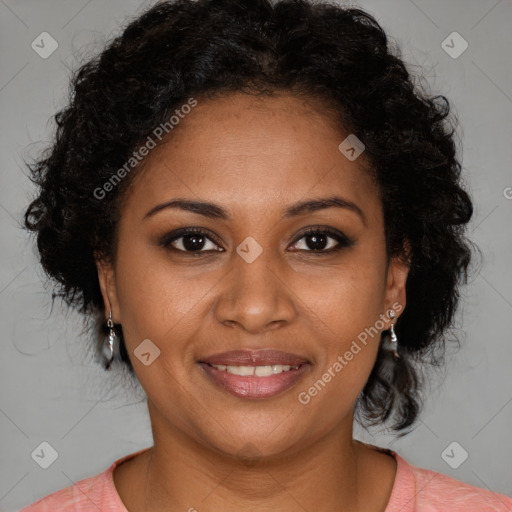 Joyful black adult female with medium  brown hair and brown eyes