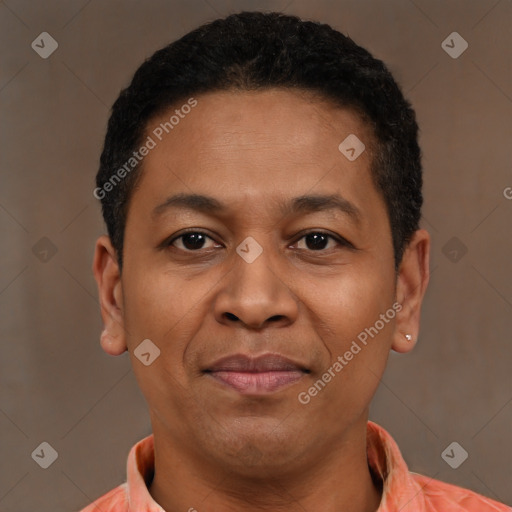 Joyful latino young-adult male with short  brown hair and brown eyes