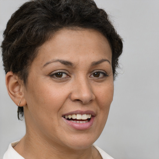 Joyful white adult female with short  brown hair and brown eyes