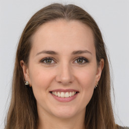 Joyful white young-adult female with long  brown hair and grey eyes