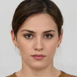 Neutral white young-adult female with short  brown hair and brown eyes