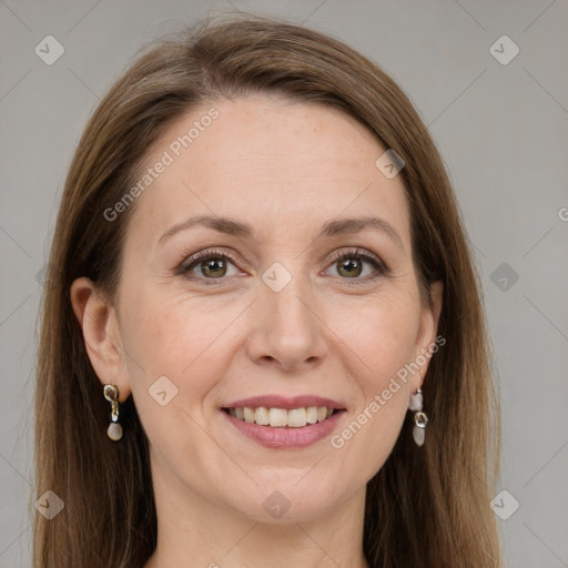 Joyful white adult female with long  brown hair and grey eyes