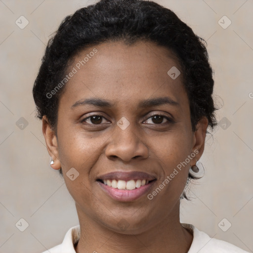 Joyful black young-adult female with short  brown hair and brown eyes