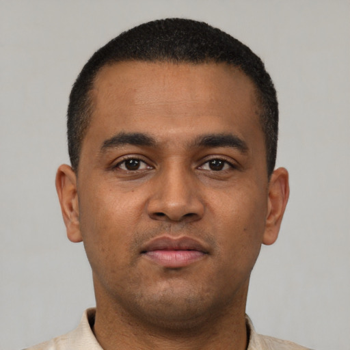 Neutral latino young-adult male with short  black hair and brown eyes