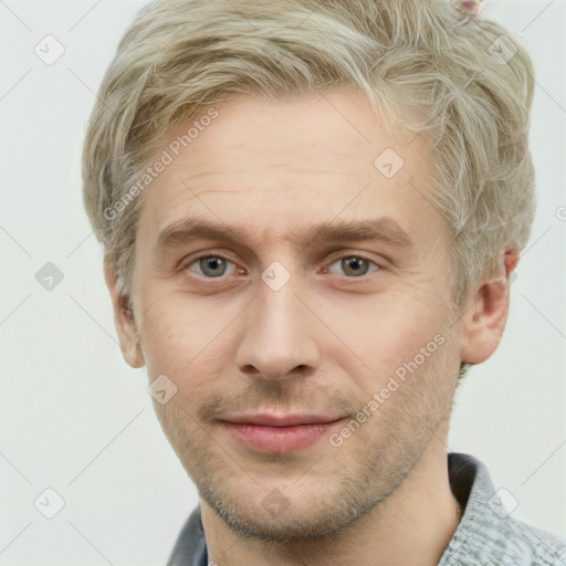 Joyful white adult male with short  brown hair and grey eyes