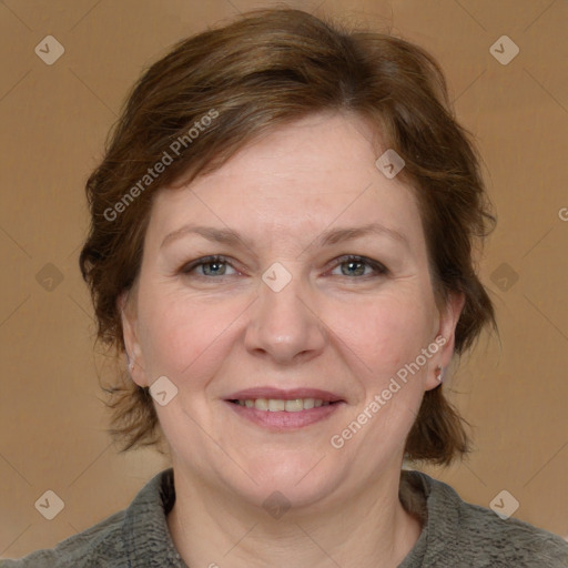 Joyful white adult female with medium  brown hair and grey eyes