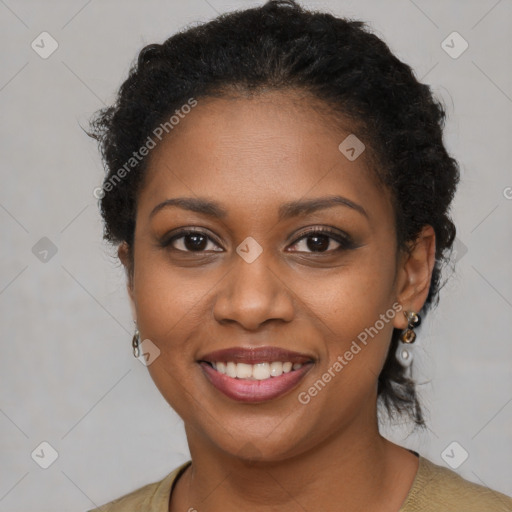 Joyful black young-adult female with short  brown hair and brown eyes