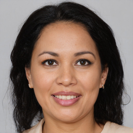 Joyful white young-adult female with medium  brown hair and brown eyes