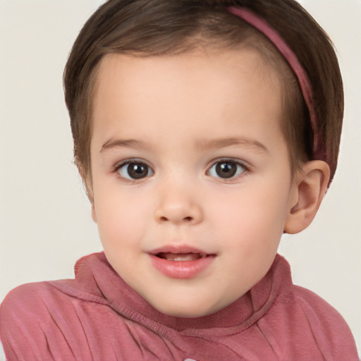 Joyful white child female with short  brown hair and brown eyes