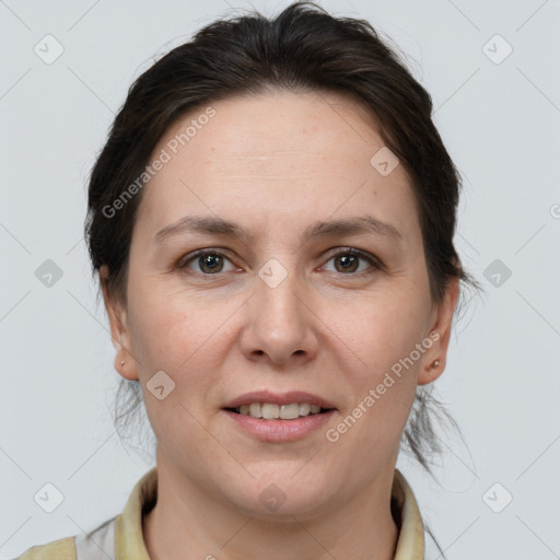 Joyful white adult female with medium  brown hair and brown eyes