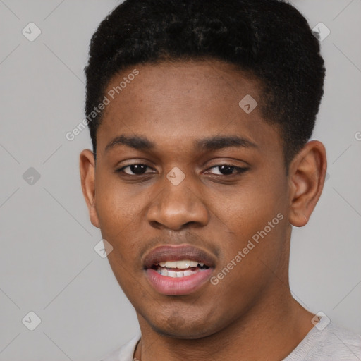 Joyful black young-adult male with short  brown hair and brown eyes