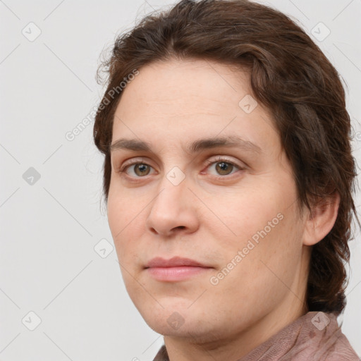 Joyful white young-adult male with short  brown hair and green eyes