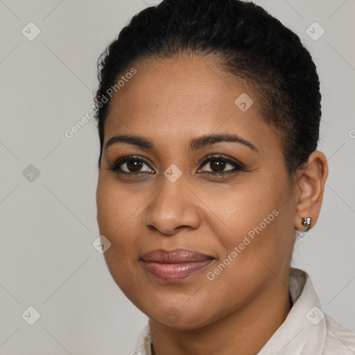 Joyful black young-adult female with short  brown hair and brown eyes