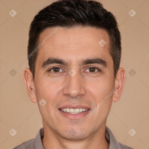 Joyful white adult male with short  brown hair and brown eyes