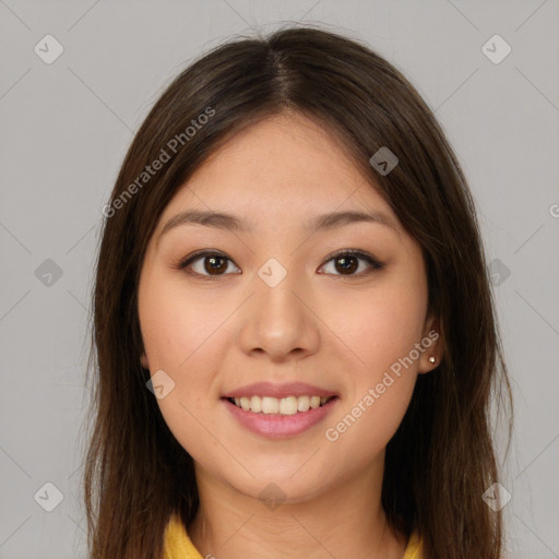 Joyful latino young-adult female with long  brown hair and brown eyes