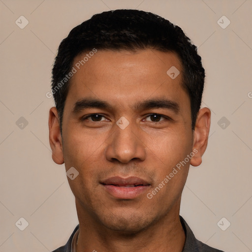 Joyful white young-adult male with short  black hair and brown eyes