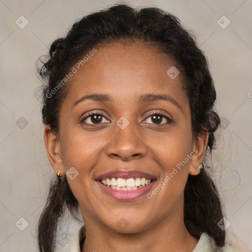 Joyful black young-adult female with medium  brown hair and brown eyes