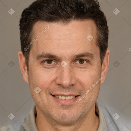 Joyful white adult male with short  brown hair and brown eyes