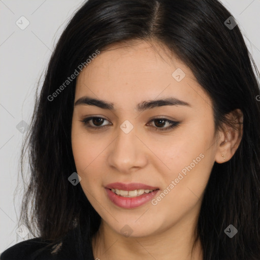 Joyful asian young-adult female with long  brown hair and brown eyes