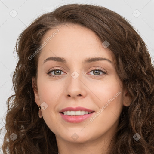 Joyful white young-adult female with long  brown hair and green eyes