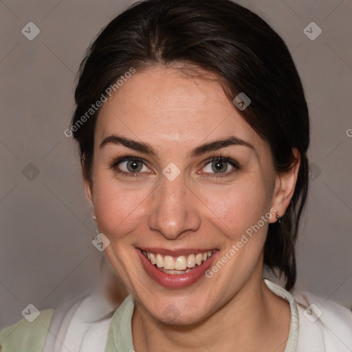 Joyful white adult female with medium  brown hair and brown eyes