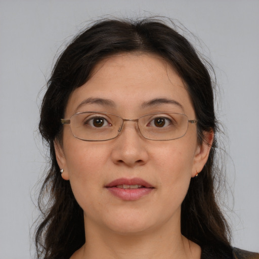 Joyful white adult female with medium  brown hair and grey eyes