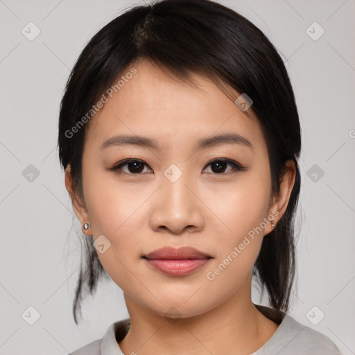 Joyful asian young-adult female with medium  black hair and brown eyes