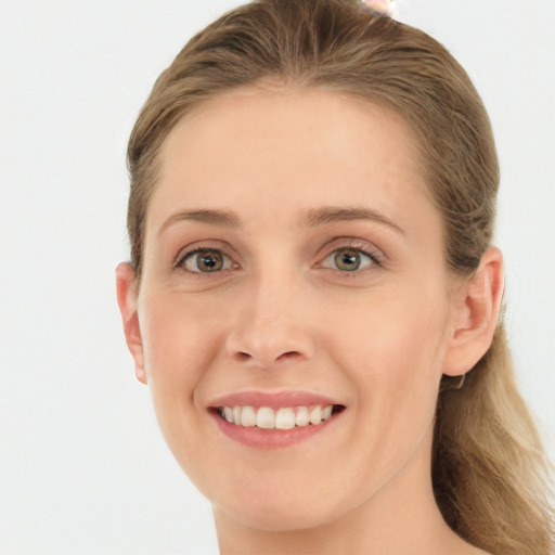 Joyful white young-adult female with long  brown hair and blue eyes