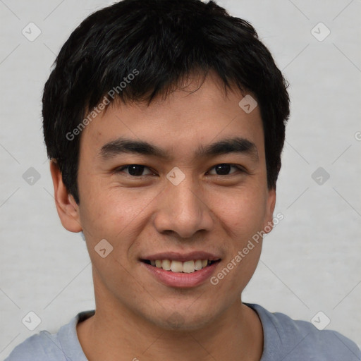 Joyful asian young-adult male with short  black hair and brown eyes