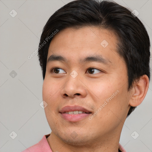 Joyful asian young-adult male with short  brown hair and brown eyes