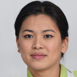 Joyful asian young-adult female with short  brown hair and brown eyes