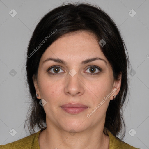 Joyful white adult female with medium  brown hair and brown eyes